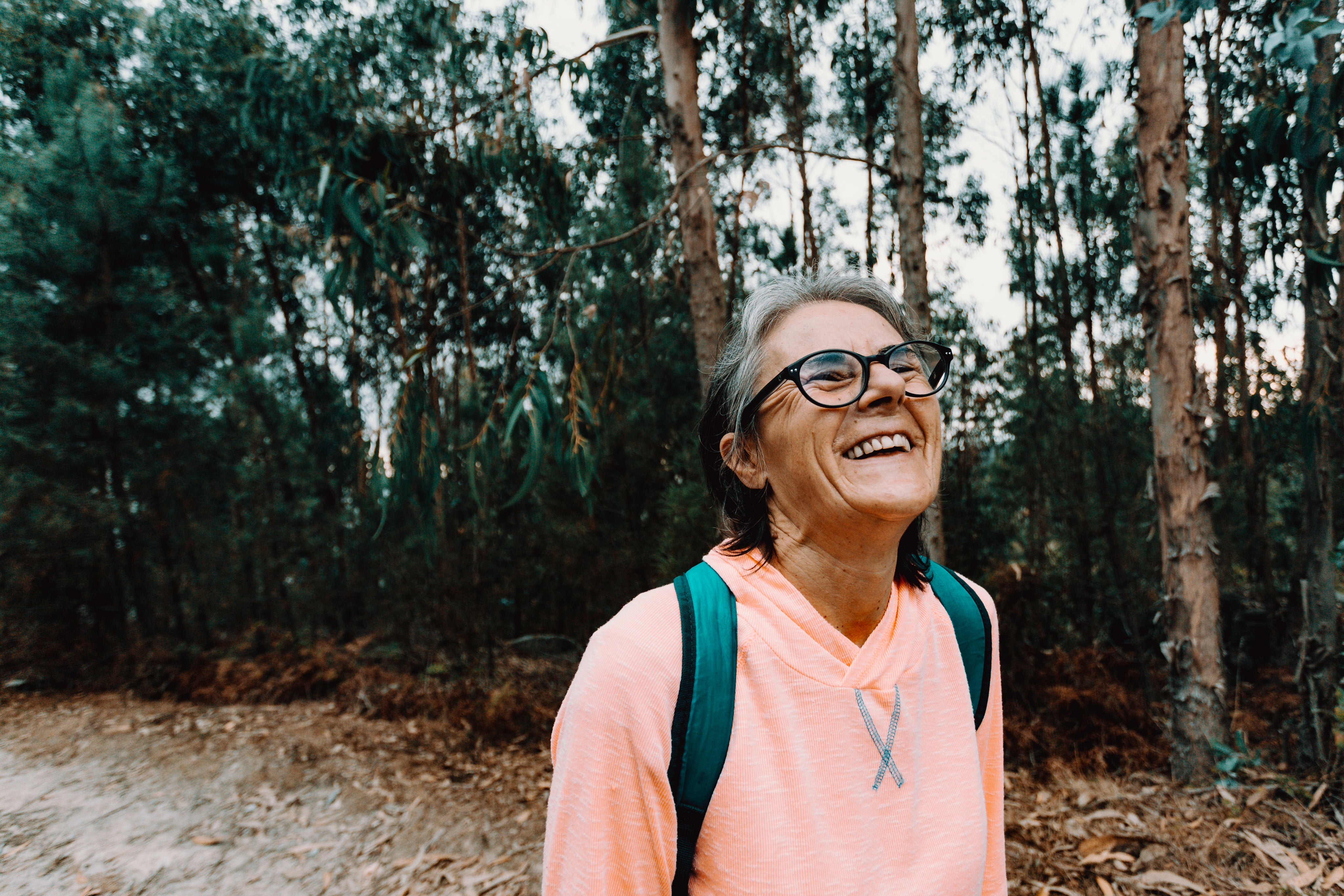 files/woman-tilts-her-head-back-and-smiles-outdoors.jpg